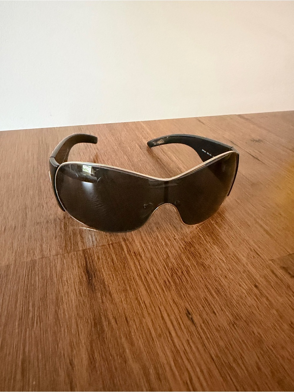 Prada Black Sunglasses with Gold Logo Accent
